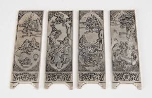 A set of four Chinese silver plaques depicting four arts of Chinese scholars with "zuyin" mark on the back, 20th Century. 14.9cm x 4.5cm (each) 