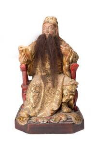 A gold lacquer wood seated figure of Guanyu?, 20th Centurycarved seated on a red lacquer wood chair supported by a square base, with the right hand holding a book, wearing detail carved dragon rob; the whole body covered in gold lacquer except the face; t