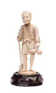 A Japanese Okimono carved ivory figure of a peasant, Meiji periord. 14.5cm 