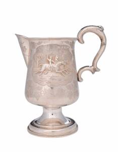 A Victorian sterling silver jug with repousse horse racing scene by Hilliard & Thomason Birmingham 1876. 17cm high