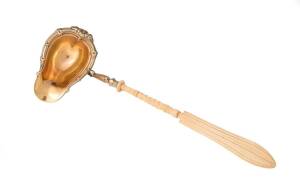 A WMF German silver plated ladle with bone handle and gilt wash interior, late 19th century. 35cm