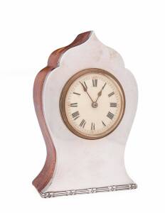 An Edward VII mantle clock, sterling silver & leather (with key) by Synyer & Beddoes  Birmingham 1904. 18cm high