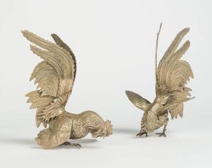 A pair of silver plate cockerels, early 20th Century. 25cm high 