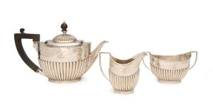 A George V three piece tea service sterling silver with ebony handles by Goldsmiths & Silversmiths Company  London, 1931. Tallest 16cm