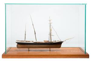 A model schooner in glass cabinet. Hand made, 20th Century. Boat 45 x 28cm