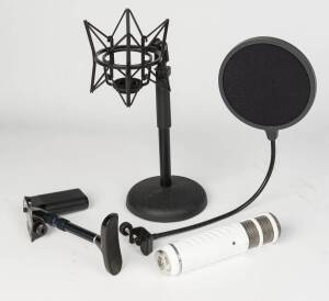 A Rode podcaster USB microphone with PSM1 shock mount and other accessories.