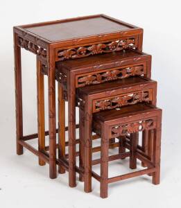 A nest of four carved chinese tea tables, 20th Century. 66cm high, 51cm wide, 36cm deep