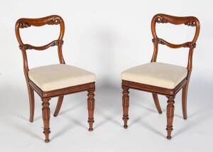 A set of twelve Victorian mahogany dining chairs with drop in seats 