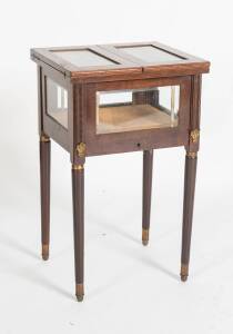 A small display case occasional table with elevating platform display shelf. 71cm high, 43cm wide, 39cm deep