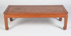 A Chinese style teak coffee table. 41cm high, 128cm wide, 51cm deep 