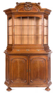 An oak bookcase with glazed upper compartment & panelled lower section, Dutch, 18th Century. 230cm high, 127cm wide, 50cm deep