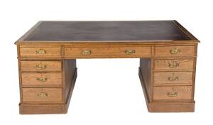 An English oak partners desk with leather insert top. 74cm high, 184cm wide, 121cm deep 