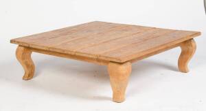 A provincial style slab top wooden coffee table, 20th Century. 31cm high, 100cm wide, 100cm deep  
