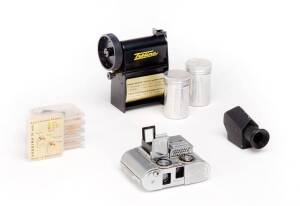 CONCAVA (Switzerland): Tessina miniature 35mm camera SN 263455 in chrome with pop-up viewfinder, slip-on meter, pentaprism viewfinder in box, Tessina Daylight Loader in original plastic case, 5 Tessina filters in original plastic containers, a Tessina bro