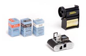 CONCAVA (Switzerland): Tessina L 35mm miniature camera in black SN 965087, with instructions, pop-up finder, slip-on meter with instructions, black leather case, tripod plate with chain and Tessina daylight Loader in original plastic case.