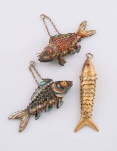 Three fish pendants, two articulated enamel. Length 7.5cm. The other with articulated textured scales. 14ct yellow gold. Weight 12.90 grams. Length 8cm. 