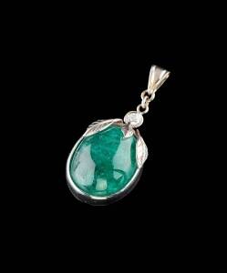 A cabochon emerald and diamond pendant. 18ct white gold. Weight 14.43 grams. Length 4.3cm.