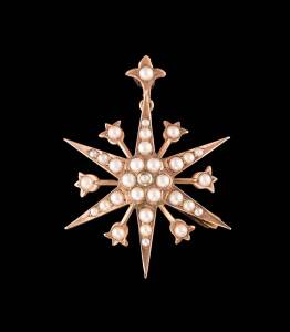 An Australian seed pearl star brooch/pendant by Alfred T Jackson, Fremantle. 9ct rose gold. Weight 7.38 grams. Length 4.5cm. 