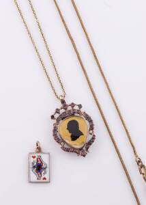 A Georgian silhouette pendant, on 9ct yellow gold chain and an enamelled pendant, 900 silver. 