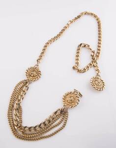 A metal Lion's head multi strand belt, in the style of Versace.