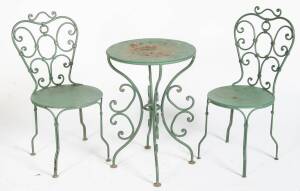 A seven piece French wrought iron cafe style garden setting, early 20th century