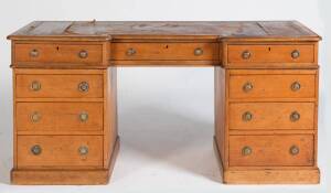 A Victorian twin pedestal desk with leather inset top, provincial English piece constructed in pine.  77cm high, 155cm wide, 59cm deep