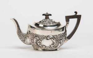 A sterling silver teapot by Walker & Hall of Sheffield, early 20th Century. 12cm high