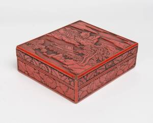 A carved red lacquer square box, late19th earl 20th Century. 7.5cm high, 24cm long, 21cm deep