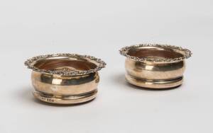 A pair of George V silver bottle coasters, Asprey & Co., London 19119cm diameter 