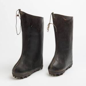 A pair of antique Chinese snow boots, leather with steel studs 