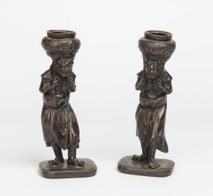 A pair of Japanese bronze figured candlesticks, 20th Century. 22.5cm high