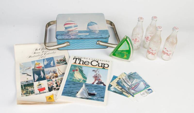 AMERICA'S CUP: 1962 Phoenix Biscuits picnic tin; 1983 group with part of sail in perspex; 1987 dozen Coca-Cola bottles in special carton.