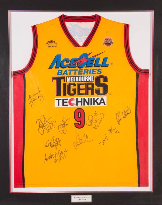 MELBOURNE TIGERS: Melbourne Tigers singlet signed by 2004 team, with 9 signatures, window mounted, framed & glazed, overall 96x118cm.  [Proceeds to Kids Under Cover].