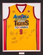 MELBOURNE TIGERS: Melbourne Tigers singlet signed by 2004 team, with 9 signatures, window mounted, framed & glazed, overall 96x118cm.&nbsp;&nbsp;[Proceeds to Kids Under Cover].