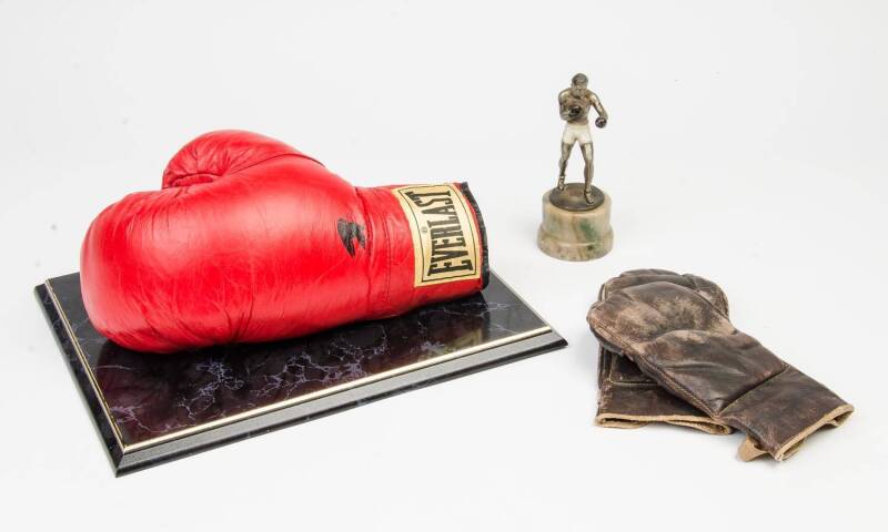 BOXING COLLECTABLES: Vintage bag mitts; "Everlast" boxing glove with faded Muhammad Ali signature (with CoA); spelter boxing figurine on marble base.