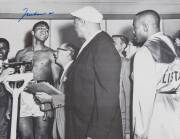 MUHAMMAD ALI, signed b/w photograph of Ali at weigh-in with Sonny Liston, size 51x41cm.