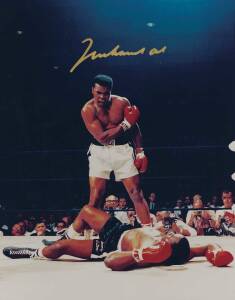 MUHAMMAD ALI, signed colour photograph of Ali standing over Sonny Liston, size 28x35cm. With CoA #0547.