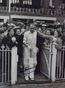 DON BRADMAN, signed photographs (5) including wonderful photograph of Bradman walking through an adoring crowd to enter the field.