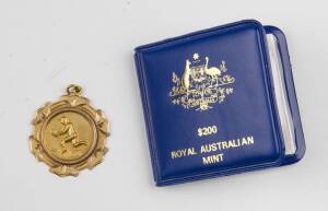 MELROSE FOOTBALL CLUB (Tasmania), 9ct gold fob with footballer on front, engraved "Melrose F.C., Won by, H.Suckling, 1930".