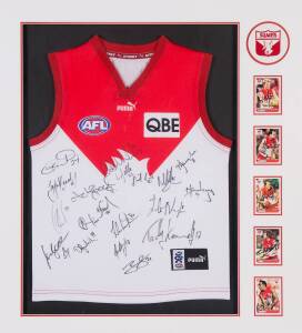 SYDNEY SWANS: Sydney Swans jumper signed by c2007 team, with 18 signatures including Adam Goodes, Brett Kirk & Ryan O'Keefe, window mounted, framed & glazed, overall 80x89cm. [Proceeds to Kids Under Cover].