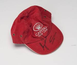 TIGER WOODS & GREG NORMAN, both signatures on Capital Golf Club cap.