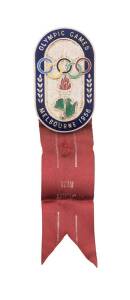 1956 OFFICIAL BADGE FOR GYMNASTICS OFFICIAL, with blue enamel border, silver background, maroon ribbon with two white stripes & "TEAM OFFICIAL", numbered 1347 on reverse.