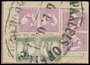 THE STANDARD ISSUE: 1/- green pair (gum-stained perfs) plus Third Wmk Kangaroos 9d violet two pairs tied to complete c.1933 parcels label by a largely very fine strike of the huge rubber 'PARCELS OFFICE/GPO/MELBOURNE' undated cancellation (deteriorated -