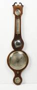 A Regency string inlaid mahogany barometer. 