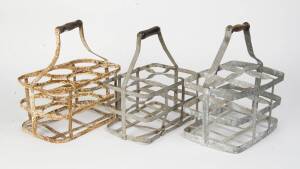 A group of 3 zinc bottle carriers.