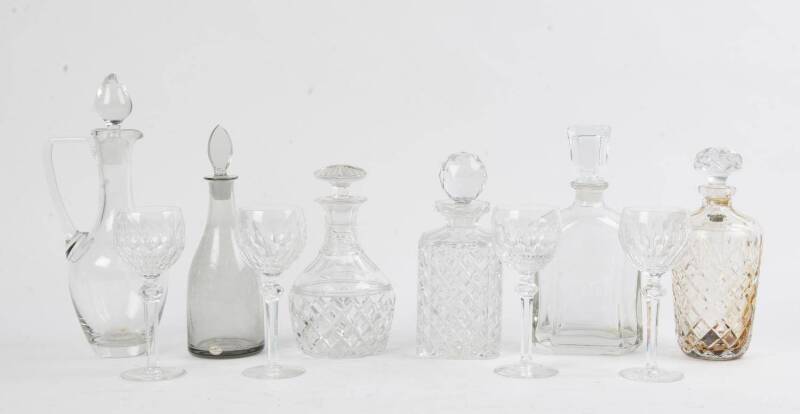 A group of six decanters including Stuart crystal plus a set of 4 Waterford crystal wine glasses. 