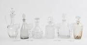 A group of six decanters including Stuart crystal plus a set of 4 Waterford crystal wine glasses. 