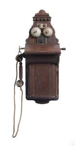 An antique wall mounted telephone by Ericsson, Sweden. 73cm.