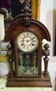 An Ansonia mantel clock, 19th Century together with a 20th Century Victorian style regulator clock. The Ansonia 60cm high, the regulator 72cm high. 