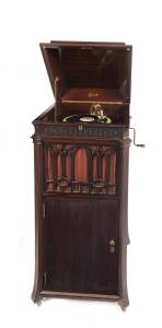 An Edison diamond disc cabinet phonograph, Chippendale model, Circa 1920. 130cm high, 56cm wide, 60cm deep. Together with a collection of phonograph discs (18 items).